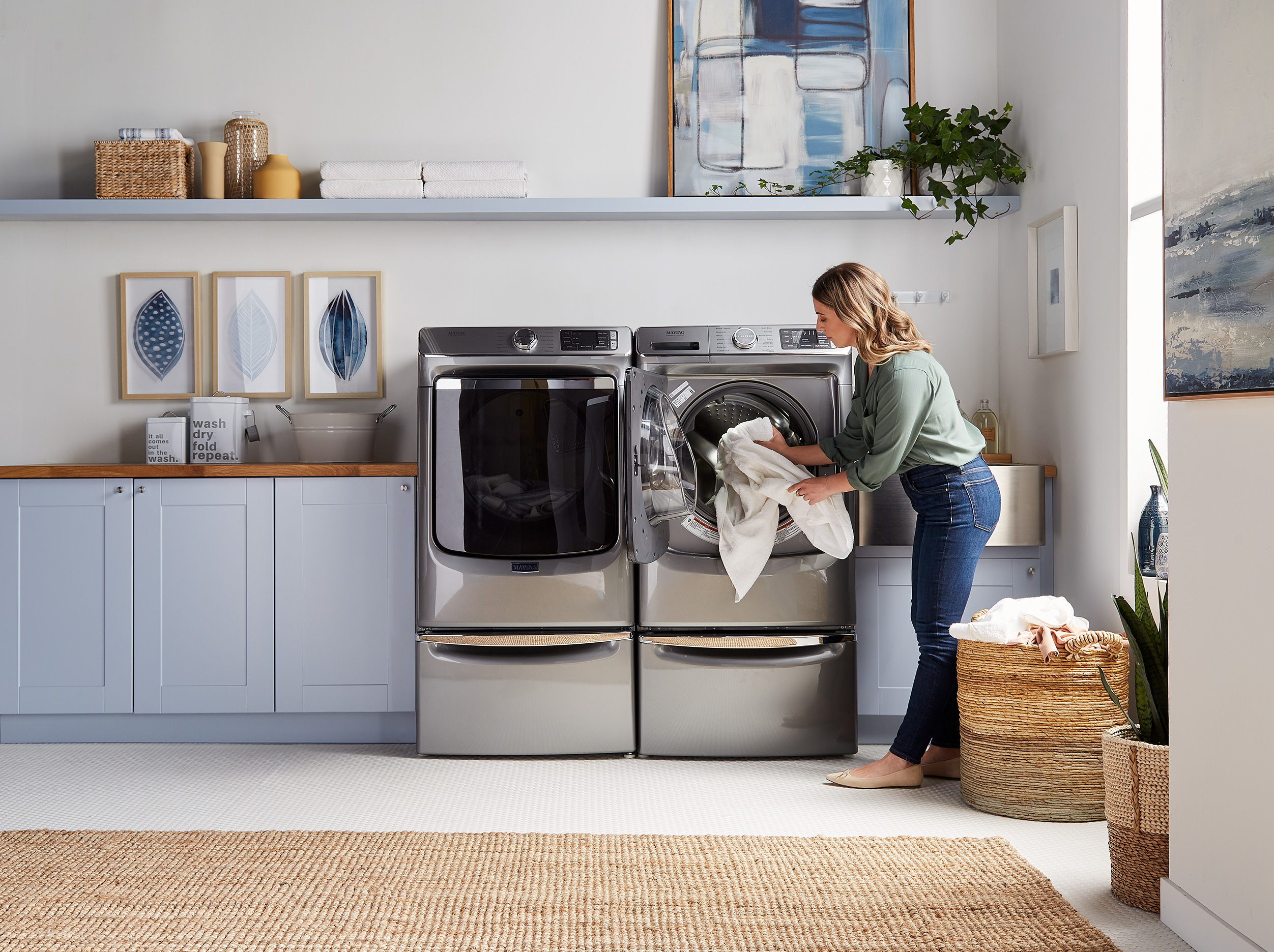 lady opening front load dryer